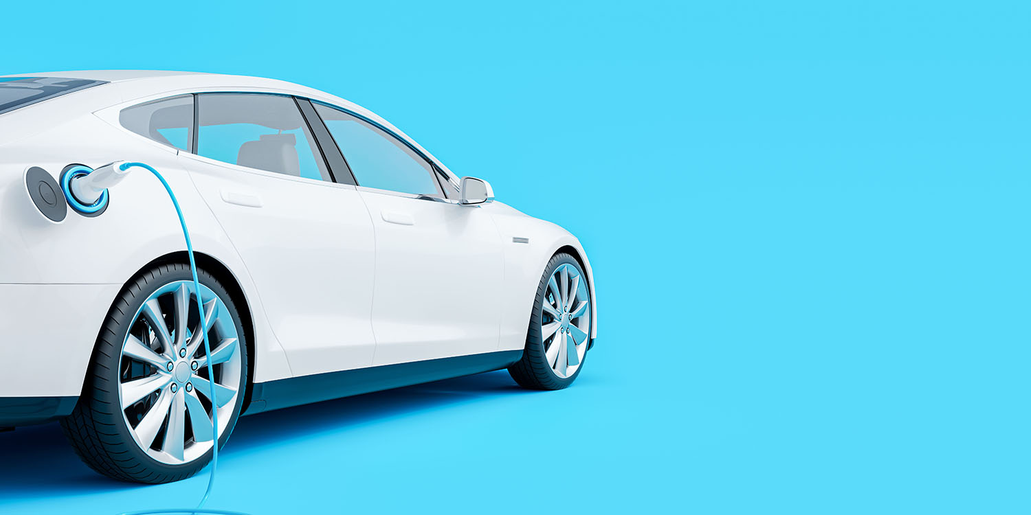 White,Electric,Car,Connected,To,Charger,On,Blue,Background,3d