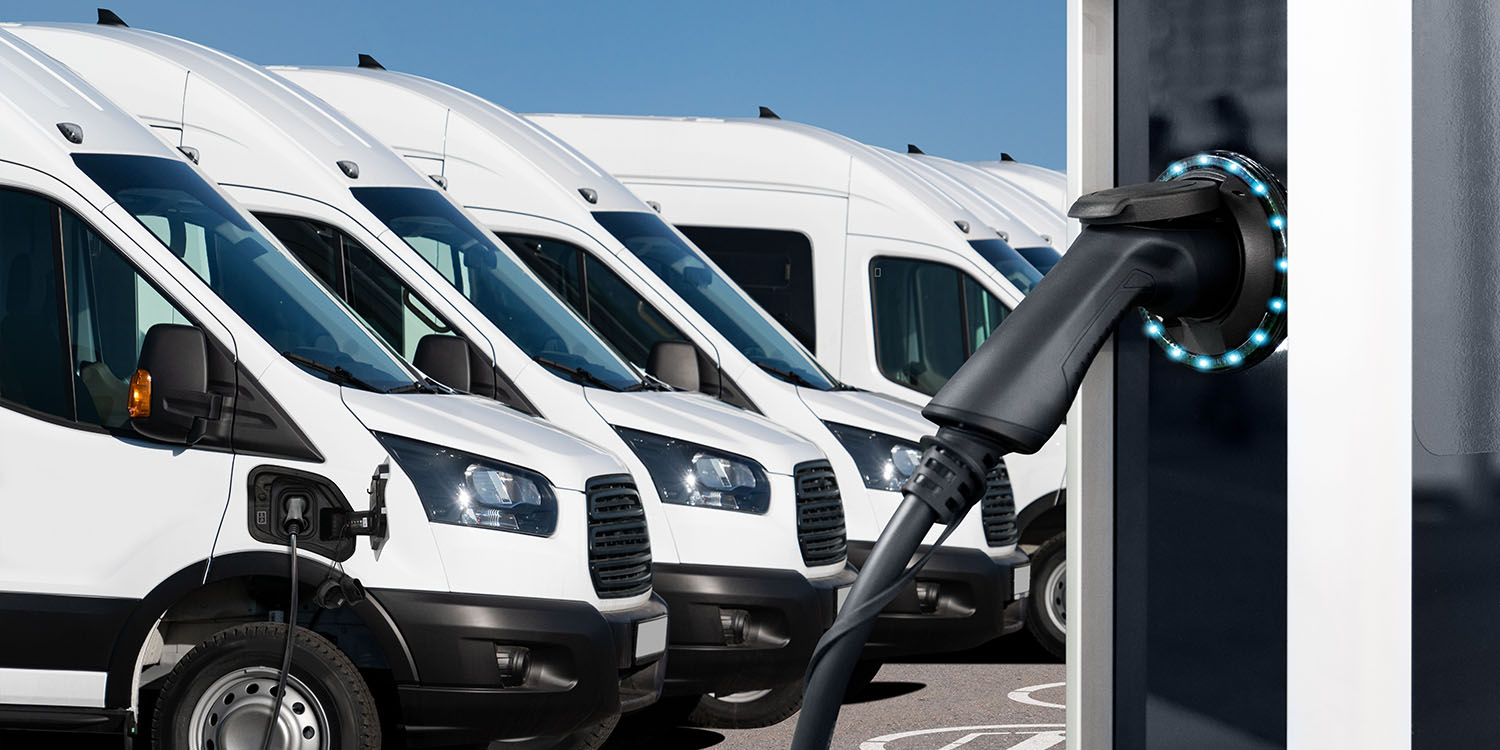 Electric,Vehicles,Charging,Station,On,A,Background,Of,A,Row